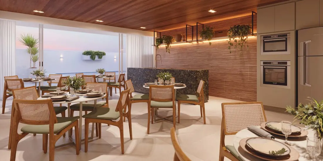 Espaço gourmet do Basílio Tijuca, com mesas, bancada em pedra e forno