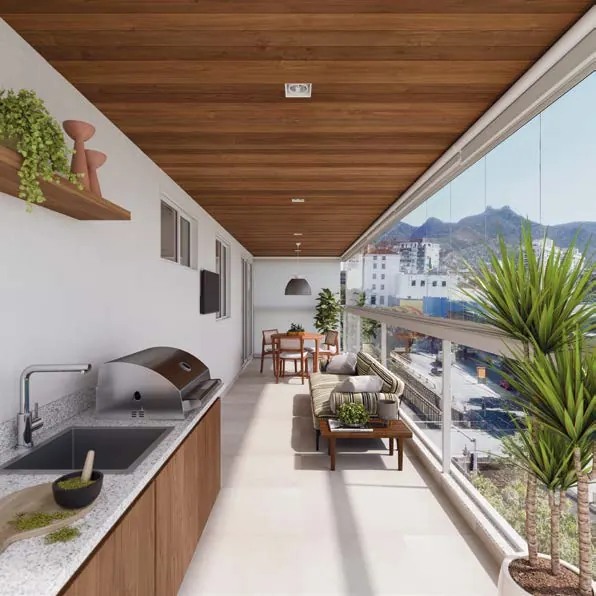 Varanda gourmet do apartamento 602 do Basílio Tijuca, com bancada, churrasqueira e vista para a Tijuca